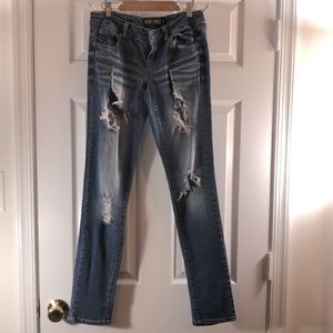 Light blue denim distressed jeans, straight leg.